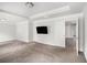Large bedroom featuring trey ceilings, carpeted floors, and adjacent bathroom at 119 Fountain Oak, Villa Rica, GA 30180