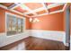 Elegant dining room featuring coffered ceiling, hardwood floors, and a large window at 119 Fountain Oak, Villa Rica, GA 30180