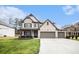 Two-story home boasts a three-car garage, well-manicured lawn, and a charming brick facade under a sunny sky at 119 Fountain Oak, Villa Rica, GA 30180
