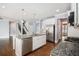 Open kitchen features granite countertops, a large island, and stainless steel appliances at 119 Fountain Oak, Villa Rica, GA 30180