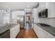 Modern kitchen with stainless appliances, granite countertops, and white subway tile backsplash at 119 Fountain Oak, Villa Rica, GA 30180