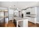 Bright eat-in kitchen features granite counters, stainless appliances, and a large island at 119 Fountain Oak, Villa Rica, GA 30180