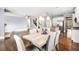 Open-concept living space combining dining area, kitchen, and living room with fireplace at 119 Fountain Oak, Villa Rica, GA 30180