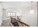 Upstairs loft area features skylight and access to bedrooms via wrought iron staircase at 119 Fountain Oak, Villa Rica, GA 30180