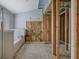 Bathroom is under construction with visible wood framing around the shower area and bathtub at 1632 Caswell Pkwy # 8, Marietta, GA 30060