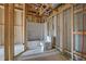 Unfinished bathroom with framed walls, toilet, and tub at 1632 Caswell Pkwy # 8, Marietta, GA 30060