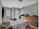 Bedroom is filled with personal belongings and has two windows at 1632 Caswell Pkwy # 8, Marietta, GA 30060