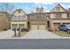 Charming townhome featuring brick and beige siding, with two-car garages and well-maintained landscaping at 1632 Caswell Pkwy # 8, Marietta, GA 30060