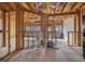 View of an unfinished living room, illustrating the framing and preparation for interior finishes at 1632 Caswell Pkwy # 8, Marietta, GA 30060