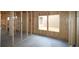 Exposed wood framing in an unfinished interior space, showing a concrete floor and stud walls at 2044 Ripple Park Bend, Canton, GA 30114