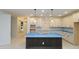 Modern kitchen featuring a large island with stylish pendant lighting and white cabinetry at 2044 Ripple Park Bnd, Canton, GA 30114