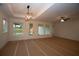 Open-concept living room with large windows, modern lighting, and easy access to the backyard at 2044 Ripple Park Bnd, Canton, GA 30114