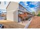 Exterior of townhomes with wood decks and stone base, offering outdoor living at 2527 Hedgeway Cir, Kennesaw, GA 30144