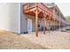 Back of house featuring wood deck, stone base, and convenient door access at 2527 Hedgeway Cir, Kennesaw, GA 30144