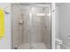 Neutral bathroom featuring a glass enclosed shower with light tile surround at 2527 Hedgeway Cir, Kennesaw, GA 30144