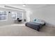 Spacious bedroom with a tray ceiling, carpeted floors, and natural light from multiple windows at 2527 Hedgeway Cir, Kennesaw, GA 30144