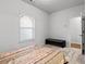 Bedroom featuring neutral walls, carpet, a window, and a dark console table at 2527 Hedgeway Cir, Kennesaw, GA 30144