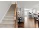 Inviting interior view showcasing the staircase and open floor plan with hardwood floors at 2527 Hedgeway Cir, Kennesaw, GA 30144