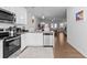 Contemporary kitchen featuring stainless steel appliances, granite countertops, and an open design at 2527 Hedgeway Cir, Kennesaw, GA 30144