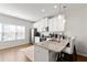 Modern kitchen with granite countertops, stainless steel appliances, breakfast bar seating, and bright lighting at 2527 Hedgeway Cir, Kennesaw, GA 30144