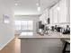 Well-lit kitchen featuring modern appliances, a breakfast bar, and ample cabinet space for storage solutions at 2527 Hedgeway Cir, Kennesaw, GA 30144