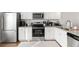 Beautiful kitchen with stainless steel appliances, granite counters, and white cabinets at 2527 Hedgeway Cir, Kennesaw, GA 30144