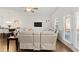 Modern living space with a view of a white reclining sofa and bright window views at 2527 Hedgeway Cir, Kennesaw, GA 30144