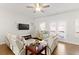 Bright living room with ample natural light, a ceiling fan, and access to a deck through sliding doors at 2527 Hedgeway Cir, Kennesaw, GA 30144