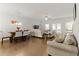 Open-concept living area featuring hardwood floors, neutral decor, and ample natural light at 2527 Hedgeway Cir, Kennesaw, GA 30144