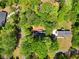 A home settled in a leafy neighborhood with a driveway leading to the backyard and surrounding greenery at 411 Buckingham Cir, Marietta, GA 30066