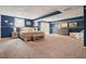 Large basement bedroom featuring plush carpet, stylish furnishings, and natural light at 411 Buckingham Cir, Marietta, GA 30066