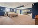 Spacious basement bedroom with carpet flooring, accent lighting, and dresser at 411 Buckingham Cir, Marietta, GA 30066