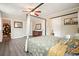 Comfortable bedroom featuring a canopy bed, neutral walls, and a ceiling fan at 411 Buckingham Cir, Marietta, GA 30066