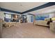 Spacious carpeted bedroom with blue trim, mountain mural, bed, sitting area and large open floor plan at 411 Buckingham Cir, Marietta, GA 30066