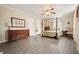 Spacious bedroom features a decorative ceiling fan, neutral walls and natural light at 411 Buckingham Cir, Marietta, GA 30066