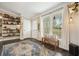 Entryway with shelves, natural light, and decorative rug, creating a warm and inviting atmosphere at 411 Buckingham Cir, Marietta, GA 30066
