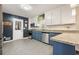 Stylish kitchen boasts stainless steel appliances, granite countertops, and ample natural light at 411 Buckingham Cir, Marietta, GA 30066