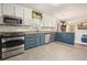 Modern kitchen features stainless steel appliances, ample counter space, and natural lighting at 411 Buckingham Cir, Marietta, GA 30066