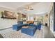 Spacious living room with a plush sectional, ceiling fan, and stylish decorative rug at 411 Buckingham Cir, Marietta, GA 30066