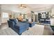 Bright and airy living room open to kitchen, with a cozy sectional sofa and stylish decor at 411 Buckingham Cir, Marietta, GA 30066