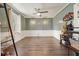 Inviting living room with hardwood floors, ceiling fan, and ample natural light at 411 Buckingham Cir, Marietta, GA 30066