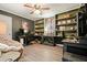 Spacious office with built-in shelves, dual desks, laminate floors, ceiling fan and comfortable seating at 411 Buckingham Cir, Marietta, GA 30066