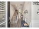 Welcoming foyer featuring wood-look flooring, a staircase, and neutral wall decor at 7206 Begonia Way # 4, Austell, GA 30168