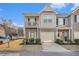 Charming townhome with a mix of brick and siding, complemented by an attached garage and a cozy balcony at 7206 Begonia Way # 4, Austell, GA 30168
