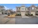 Inviting townhome with a mix of brick and siding, featuring an attached garage and a balcony at 7206 Begonia Way # 4, Austell, GA 30168