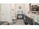 Cozy living space featuring fish tank, additional seating area, and tile floors, adjacent to kitchen at 7206 Begonia Way # 4, Austell, GA 30168