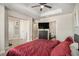 Main bedroom showcasing neutral paint and adjoining bathroom and closet at 7206 Begonia Way # 4, Austell, GA 30168