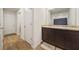 Bathroom featuring a double sink vanity with dark cabinets and granite countertops at 13699 Inman Rd, Hampton, GA 30228