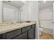 Bathroom features a vanity, and a bathtub with shower at 13699 Inman Rd, Hampton, GA 30228