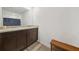 Bathroom featuring a double sink vanity with dark cabinets and granite countertops at 13699 Inman Rd, Hampton, GA 30228